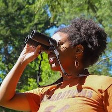 Dara Wilson looks from binoculars