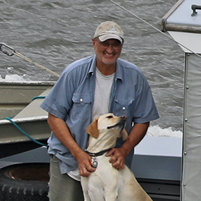 A photo of John Lipscomb with his dog