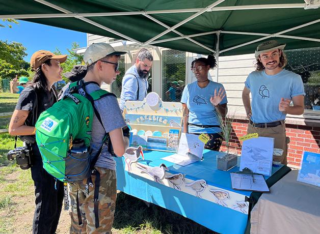 Volunteers from the Plover Project talking to members of the public.