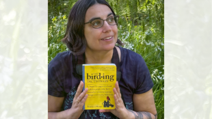 Rosemary Mosco holds a copy of her latest book in her hands