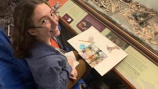 Michelle drawing at Field Museum