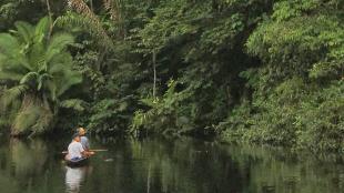 Two people in a canoe on Zabalo river in Ecuador