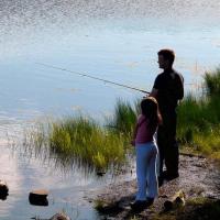 Dad and kid fishing